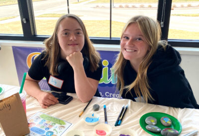 CORE Programs 2 CORE participant and volunteer painting in a CORE art class